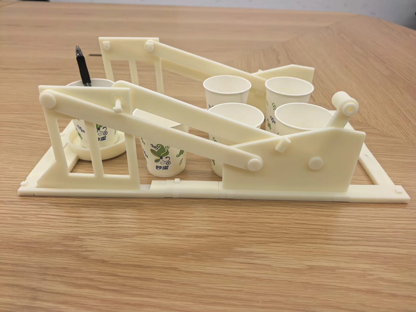 Printed cup-access machine with its target cup at the rear