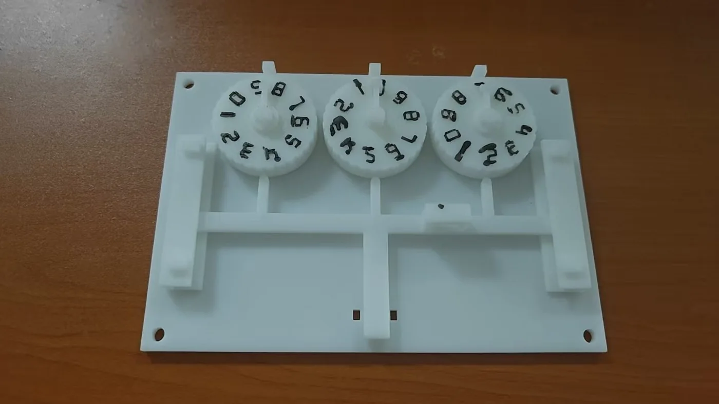 Printed three-digit combination lock with numbered code wheels